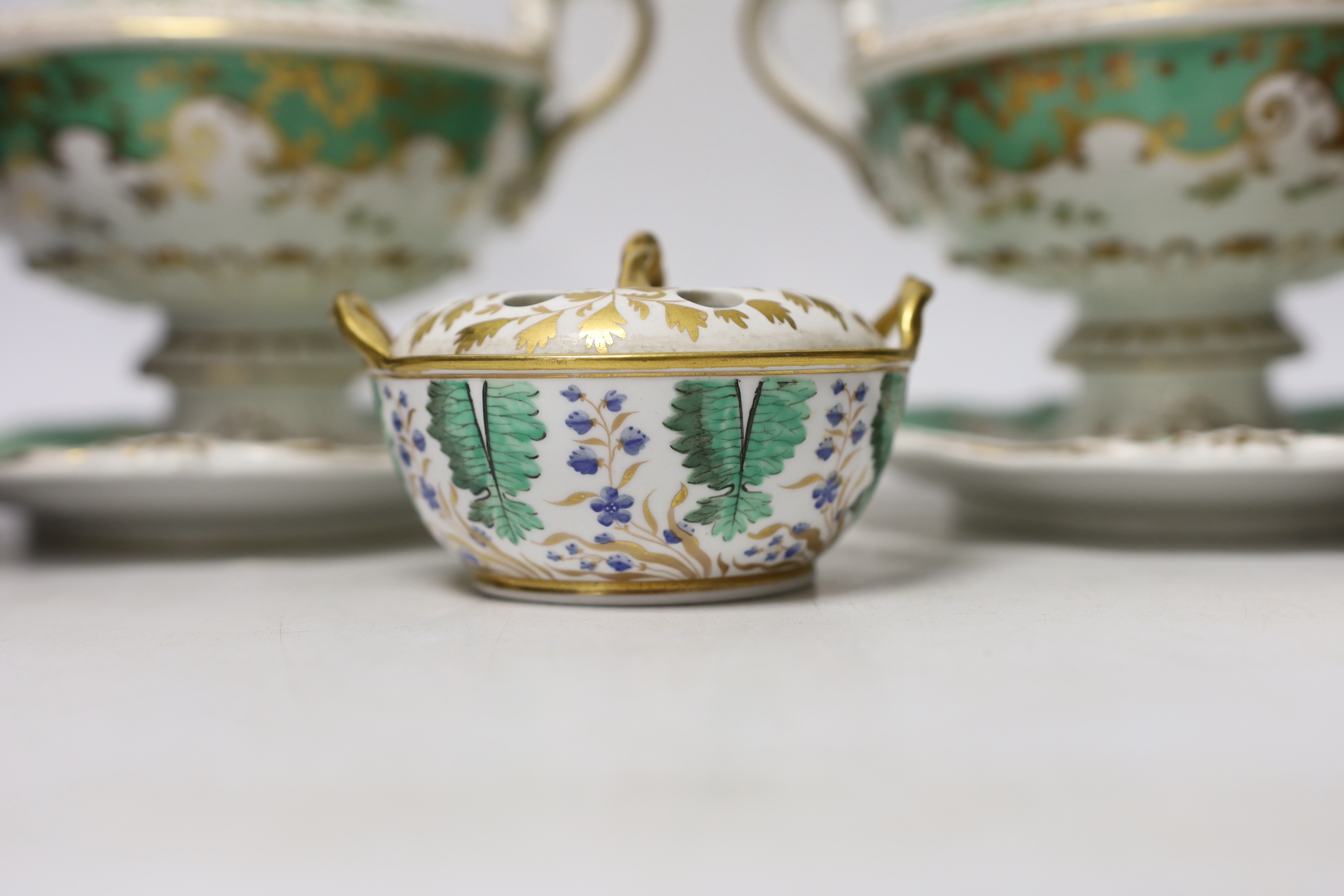 Early 19th century English porcelain including a Wedgwood pot pourri bowl and cover, two sauce tureens covers with integral stands, a butterfly painted trio and a bird painted spill vase